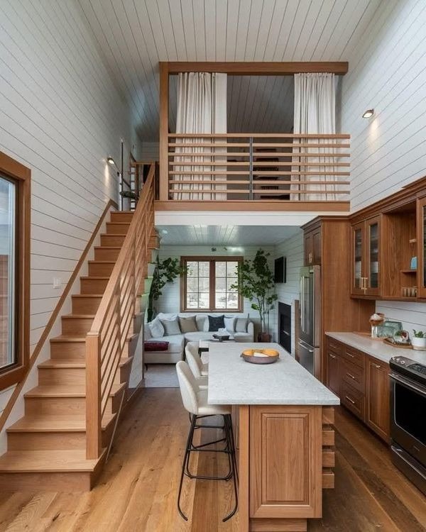 Modern cabin kitchen and living room with loft area