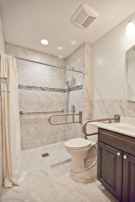 Accessible bathroom with walk in shower and safety grab bars