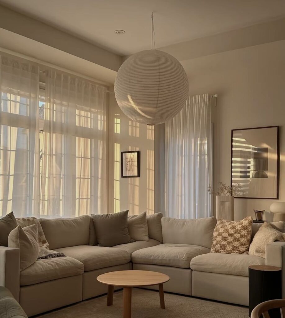 Cozy neutral living room with warm sunlight and soft textures