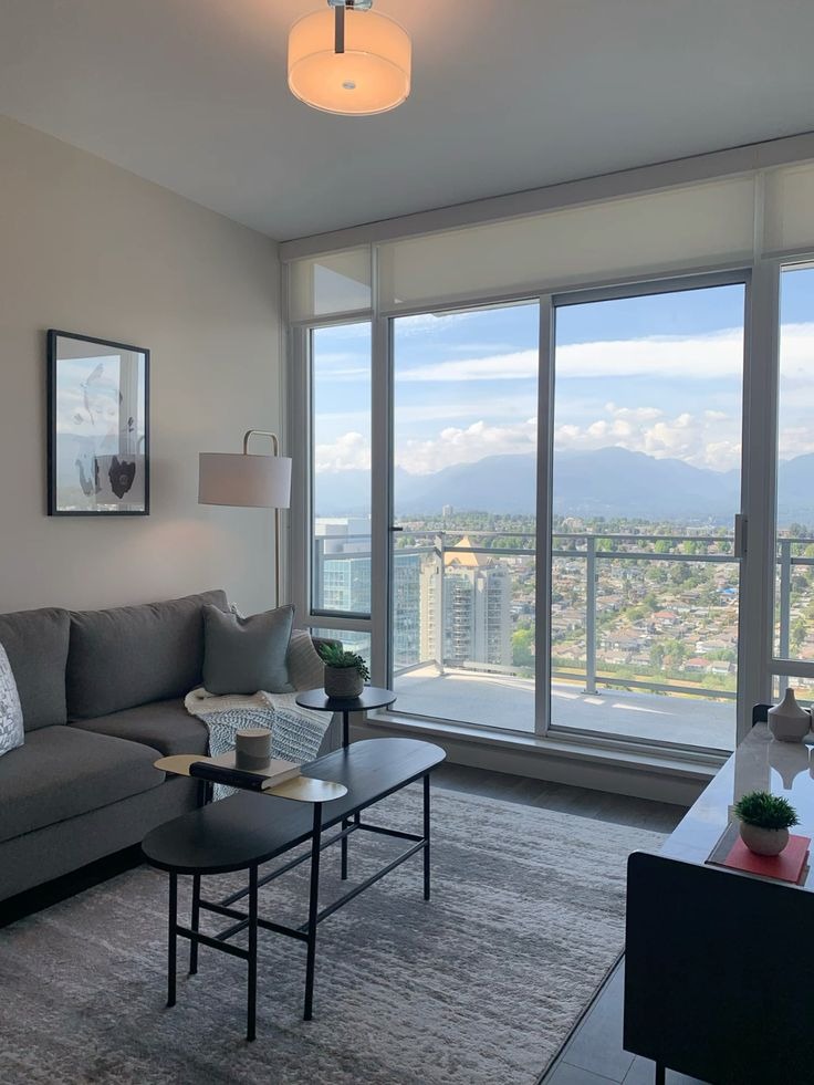 Modern high rise condo living room with large city views