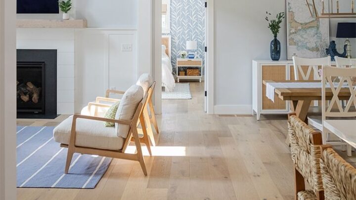 Coastal open concept living space with light hardwood floors